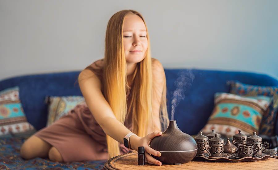 woman using an oil diffuser